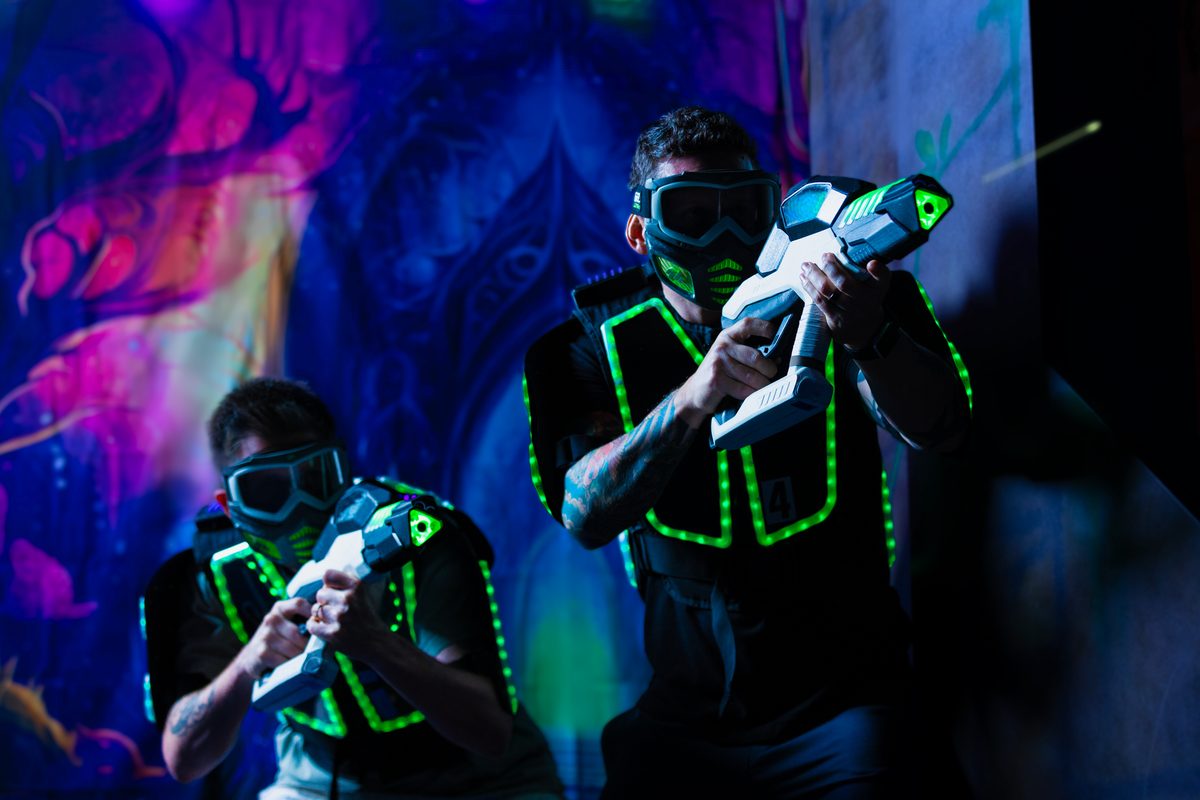Players aiming smart blasters in a Nexus Gel Blasters arena