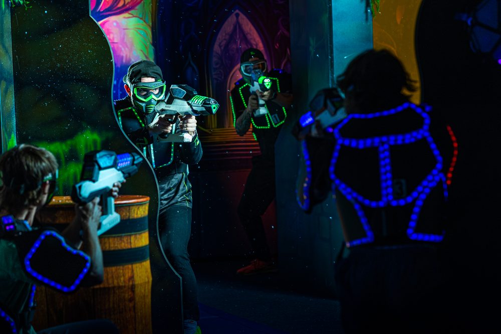 Players in a glowing Nexus Gel Blasters arena battle
